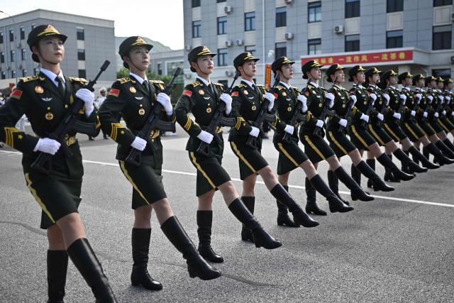Chinese military personnel take part in a rehearsal ahead of the parade commemorating the 80th anniversary of the victory in the Chinese People's War of Resistance Against Japanese Aggression and the World Anti-Fascist War, which will be held on September 3, in Beijing on August 20, 2025. (Photo by Pedro PARDO / AFP)