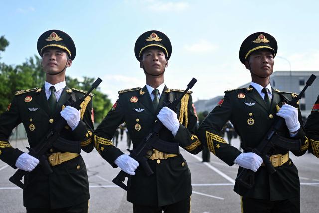 Chinese military personnel take part in a rehearsal ahead of the parade commemorating the 80th anniversary of the victory in the Chinese People's War of Resistance Against Japanese Aggression and the World Anti-Fascist War, which will be held on September 3, in Beijing on August 20, 2025. (Photo by Pedro PARDO / AFP)