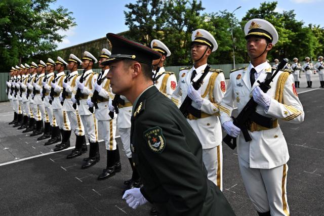 Chinese military personnel take part in a rehearsal ahead of the parade commemorating the 80th anniversary of the victory in the Chinese People's War of Resistance Against Japanese Aggression and the World Anti-Fascist War, which will be held on September 3, in Beijing on August 20, 2025. (Photo by Pedro PARDO / AFP)