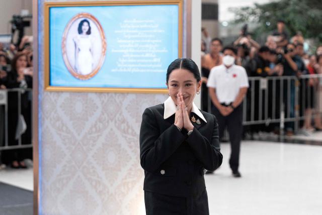 Thailand's suspended Prime Minister Paetongtarn Shinawatra gestures as she leaves the Constitutional Court in Bangkok on August 21, 2025. Thailand's suspended prime minister Paetongtarn Shinawatra testified on August 21 in a case seeking her removal from office over her handling of the kingdom's border row with Cambodia. (Photo by Chanakarn Laosarakham / AFP)