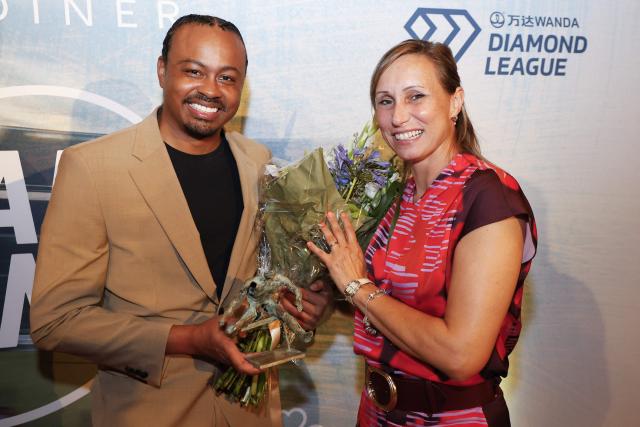 Former Belgian steeple athlete William Van Dijck (L) and Memorial Van Damme meeting director Kim Gevaert pose during a gala dinner before the 49th edition of the Memorial Van Damme athletics event in Brussels on August 21, 2025. (Photo by NICOLAS MAETERLINCK / Belga / AFP) / Belgium OUT