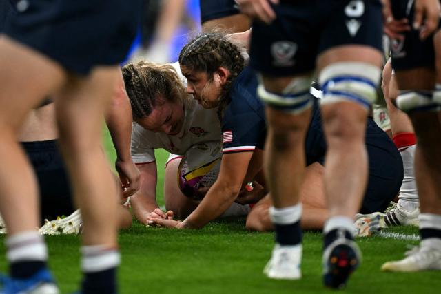 England's Lark Atkin-Davies scores a try during the Women’s Rugby World Cup pool A match between England and United States at the Stadium of Light in Sunderland, northeast England, on August 22, 2025. (Photo by Paul ELLIS / AFP)