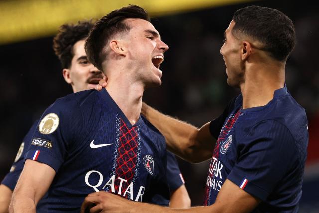 Paris Saint-Germain's Spanish midfielder #08 Fabian Ruiz celebrates scoring his team's first goal during the French L1 football match between Paris Saint-Germain (PSG) and Angers SCO at the Parc des Princes Stadium in Paris on August 22, 2025. (Photo by FRANCK FIFE / AFP)