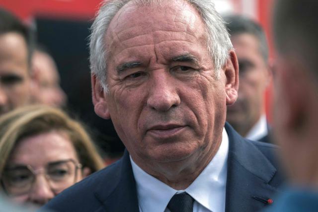 (FILES) France's Prime Minister Francois Bayrou looks on during a visit to a field command post set up in Saint-Laurent-de-la-Cabrerisse, southern France, where a wildfire has scorched a vast area on August 6, 2025. French Prime Minister Francois Bayrou vowed on August 22, 2025, to uncover lawmakers and officials who take undue benefit, warning that the public believes all politicians are "lining their pockets". (Photo by Idriss BIGOU-GILLES / AFP)