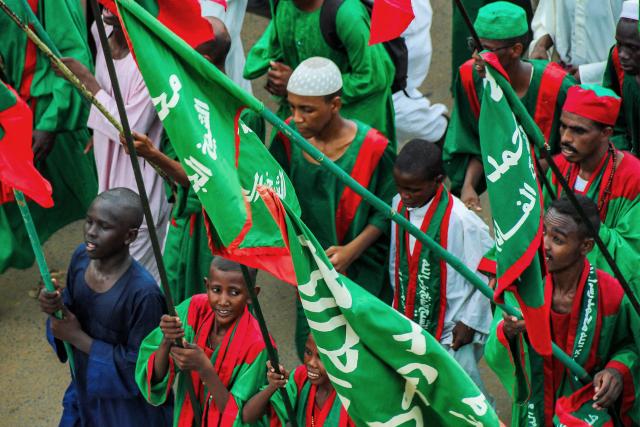 Muslim devotees march in a religious procession ahead of commemorations of the birthday of Islam's Prophet Mohamed in Omdurman, the twin-city of Sudan's capital, on August 23, 2025. (Photo by AFP)