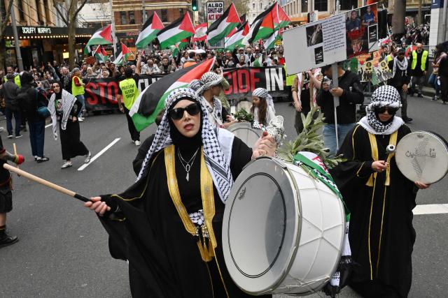 Demonstrators take part in a pro-Palestinian rally against Israel's actions and ongoing food shortages in the Gaza Strip, which the UN officially declared a famine on August 22, during a protest in Sydney's central business district on August 24, 2025. (Photo by Saeed KHAN / AFP)