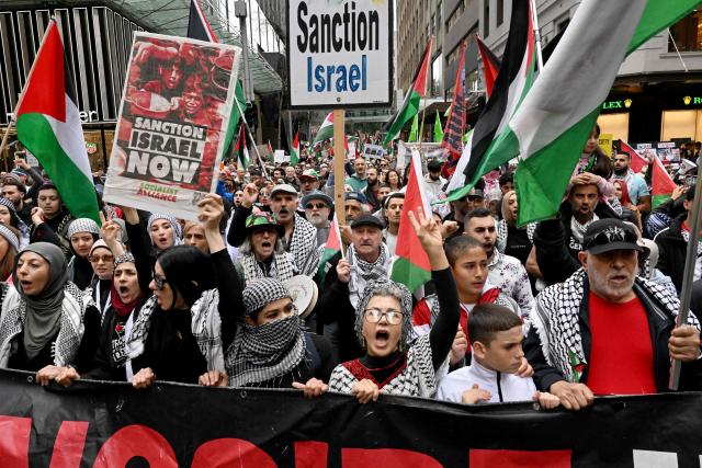 Demonstrators take part in a pro-Palestinian rally against Israel's actions and ongoing food shortages in the Gaza Strip, which the UN officially declared a famine on August 22, during a protest in Sydney's central business district on August 24, 2025. (Photo by Saeed KHAN / AFP)