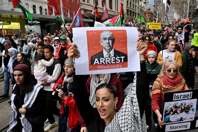 Demonstrators take part in a pro-Palestinian rally against Israel's actions and ongoing food shortages in the Gaza Strip, which the UN officially declared a famine on August 22, during a protest in Sydney's central business district on August 24, 2025. (Photo by Saeed KHAN / AFP)