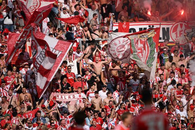 FC Cologne's fans celebrate the 0-1 during the German first division Bundesliga football match Mainz 05 v FC Cologne on August 24, 2025 in Mainz. (Photo by Kirill KUDRYAVTSEV / AFP) / DFL REGULATIONS PROHIBIT ANY USE OF PHOTOGRAPHS AS IMAGE SEQUENCES AND/OR QUASI-VIDEO