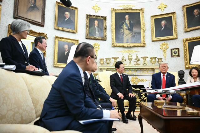 US President Donald Trump and South Korean President Lee Jae Myung attend a bilateral meeting in the Oval Office of the White House in Washington, DC, on August 25, 2025. Trump on Monday suggested that a "purge or revolution" was underway in South Korea, hours before new President Lee Jae Myung was due at the White House. He did not specify to what he was referring but said he would bring it up with Lee. (Photo by Mandel NGAN / AFP)