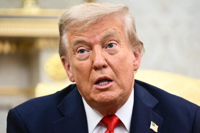 US President Donald Trump speaks during a bilateral meeting with South Korean President Lee Jae Myung in the Oval Office of the White House in Washington, DC, on August 25, 2025. Trump on Monday suggested that a "purge or revolution" was underway in South Korea, hours before new President Lee Jae Myung was due at the White House. He did not specify to what he was referring but said he would bring it up with Lee. (Photo by Mandel NGAN / AFP)