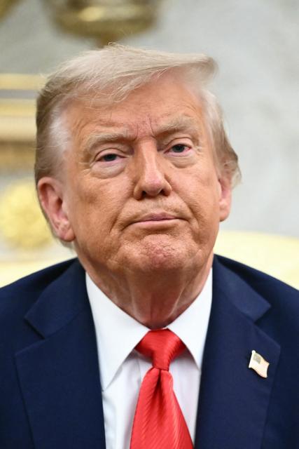 US President Donald Trump looks on during a bilateral meeting with South Korean President Lee Jae Myung in the Oval Office of the White House in Washington, DC, on August 25, 2025. Trump on Monday suggested that a "purge or revolution" was underway in South Korea, hours before new President Lee Jae Myung was due at the White House. He did not specify to what he was referring but said he would bring it up with Lee. (Photo by Mandel NGAN / AFP)