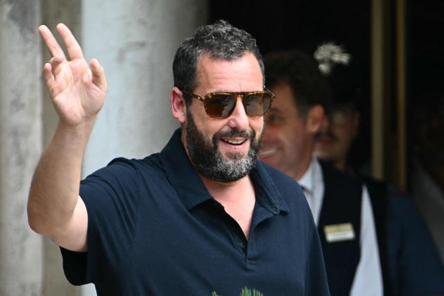 US actor Adam Sandler arrives at the Excelsior pier during the 82nd Venice International Film Festival at Venice Lido, on August 27, 2025. (Photo by Stefano RELLANDINI / AFP)