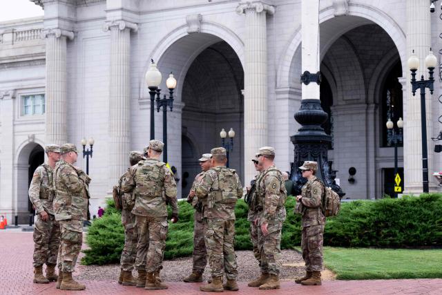 (FILES) Members of the National Guard stand watch outside of Union Station in Washington, DC, August 21, 2025. According to US media reports on August 27, the US Department of Transportation is planning to take over management of Union Station in Washington, DC. (Photo by SAUL LOEB / AFP)