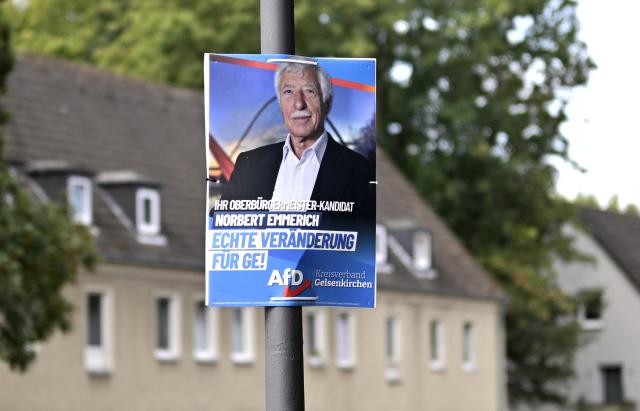 An election campaign placard of the far-right Alternative for Germany (AFD) party shows their mayor candidate Norbert Emmerich, in Gelsenkirchen, western Germany on August 27, 2025. On 14 September 2025, local elections will be held in North Rhine-Westphalia, Germany's most populous federal state. The election is expected to see gains for the AfD, a party with extreme right-wing elements in some parts, in the SPD's only stronghold. (Photo by Ina FASSBENDER / AFP)