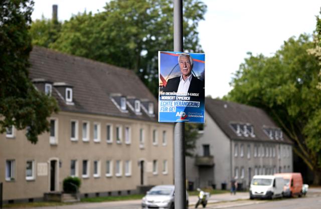 An election campaign placard of the far-right Alternative for Germany (AFD) party shows their mayor candidate Norbert Emmerich, in Gelsenkirchen, western Germany on August 27, 2025. On 14 September 2025, local elections will be held in North Rhine-Westphalia, Germany's most populous federal state. The election is expected to see gains for the AfD, a party with extreme right-wing elements in some parts, in the SPD's only stronghold. (Photo by Ina FASSBENDER / AFP)