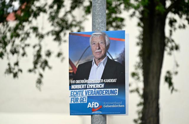 An election campaign placard of the far-right Alternative for Germany (AFD) party shows their mayor candidate Norbert Emmerich, in Gelsenkirchen, western Germany on August 27, 2025. On 14 September 2025, local elections will be held in North Rhine-Westphalia, Germany's most populous federal state. The election is expected to see gains for the AfD, a party with extreme right-wing elements in some parts, in the SPD's only stronghold. (Photo by Ina FASSBENDER / AFP)