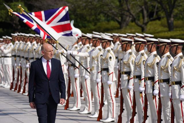 Britain's Defence Secretary John Healey inspects an honour guard during a ceremonial welcome at the Ministry of Defence in Tokyo on August 28, 2025. (Photo by Kazuhiro NOGI / AFP)