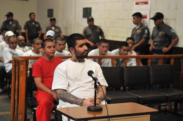 (FILES) Aldo Ochoa aka "Lobo", member of the Mara 18 gang, is tried in Guatemala City on September 16, 2010. Guatemalan police arrested Maria Martha Castaneda Torres on August 27, 2025. She is the partner of 'El Lobo,' a jailed leader of the violent Barrio 18 gang. Authorities said she is accused of multiple crimes and of maintaining ties with the imprisoned gang leader. (Photo by JOHAN ORDONEZ / AFP)