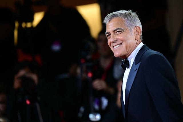 US actor George Clooney walks the red carpet before the screening of the movie "Jay Kelly" presented in competition at the 82nd International Venice Film Festival, at Venice Lido on August 28, 2025. (Photo by Tiziana FABI / AFP)
