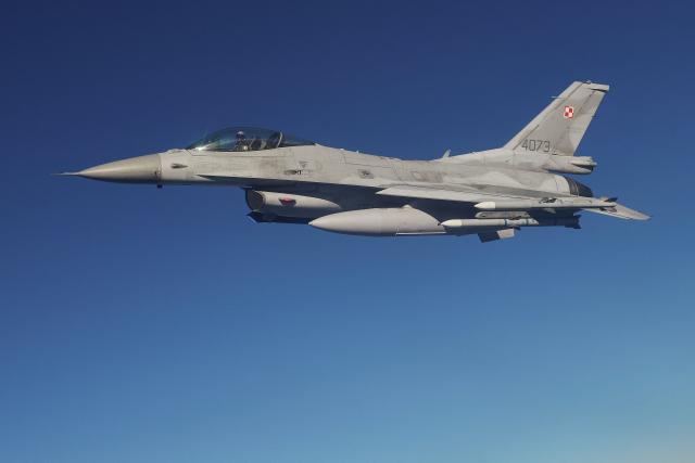 (FILES) A F 16 fighter jet takes part in the NATO Air Shielding exercise near the air base in Lask, central Poland on October 12, 2022. A Polish F-16 fighter jet crashed on August 28, 2025 while preparing for an air show in the central city of Radom, killing the pilot, a government spokesperson said. (Photo by RADOSLAW JOZWIAK / AFP)