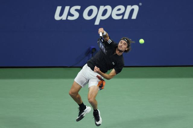 Greece’s Stefanos Tsitsipas serves to Germany’s Daniel Altmaier during their men's singles second round tennis match on day five of the US Open tennis tournament at the USTA Billie Jean King National Tennis Center in New York City, on August 28, 2025. (Photo by CHARLY TRIBALLEAU / AFP)