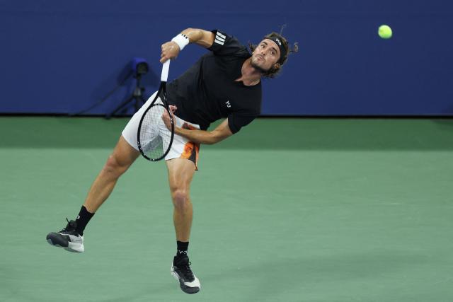 Greece’s Stefanos Tsitsipas serves to Germany’s Daniel Altmaier during their men's singles second round tennis match on day five of the US Open tennis tournament at the USTA Billie Jean King National Tennis Center in New York City, on August 28, 2025. (Photo by CHARLY TRIBALLEAU / AFP)