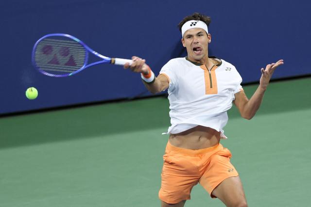 Germany’s Daniel Altmaier hits a forehand return to Greece’s Stefanos Tsitsipas during their men's singles second round tennis match on day five of the US Open tennis tournament at the USTA Billie Jean King National Tennis Center in New York City, on August 28, 2025. (Photo by CHARLY TRIBALLEAU / AFP)