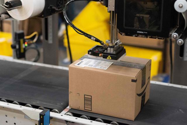 (FILES) A package is labeled at a SLAM, or scan, label, apply and manifest during a tour of Amazon's Fulfillment Center, September 21, 2018 in Kent, Washington. The United States on August 29, 2025 ended tariff exemptions on small packages entering the country from abroad, in a move that has sparked concern among small businesses and warnings of consumer price hikes. (Photo by Grant HINDSLEY / AFP)