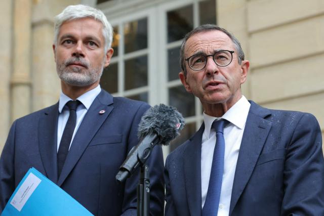 President of French right-wing Les Republicains (LR) party, France's Minister of the Interior Bruno Retailleau (R) and President of the Droite Republicaine group at the National Assembly Laurent Wauquiez (L) deliver a statement to journalists after attending a meeting with France's Prime Minister as part of political consultations at the Hotel de Matignon in Paris, on September 2, 2025, a week before the French National Assembly's vote of confidence. (Photo by Thomas SAMSON / AFP)
