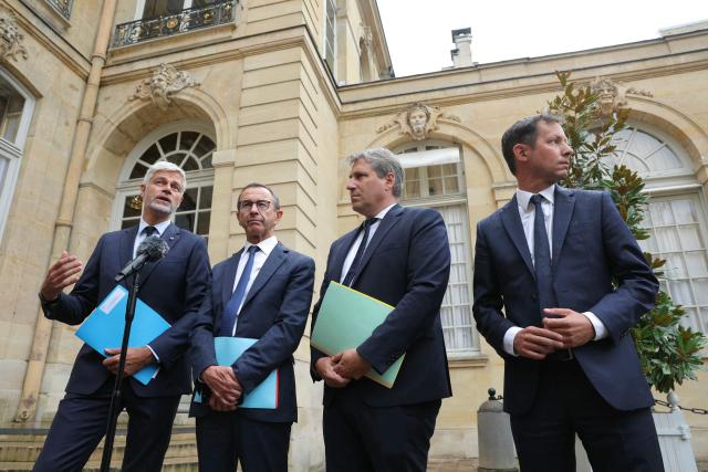 President of French right-wing Les Republicains (LR) party, France's Minister of the Interior Bruno Retailleau (2nd L), President of the Droite Republicaine group at the National Assembly Laurent Wauquiez (L), President of Les Republicains group at the Senate Mathieu Darnaud (2nd R) and Executive Vice President of Les Republicains Francois-Xavier Bellamy (R) deliver a statement to journalists after attending a meeting with France's Prime Minister as part of political consultations at the Hotel de Matignon in Paris, on September 2, 2025, a week before the French National Assembly's vote of confidence. (Photo by Thomas SAMSON / AFP)