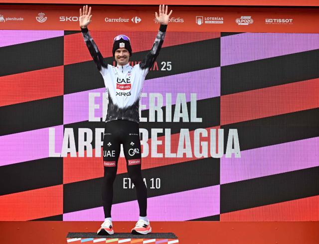 Team UAE's Australian rider Jay Vine celebrates on the podium after winning the tenth stage of the Vuelta a Espana cycling tour, a 168 km race between Sendaviva Natural Park in Arguedas and El Ferial Larra Belagua in Isaba, on September 2, 2025. (Photo by Ander GILLENEA / AFP)
