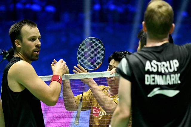 Denmark's Kim Astrup (R) and Denmark's Anders Rasmussen celebrate beating Japan's Yugo Kobayashi and Japan's Takuro Hoki during the men's double quarter-final match at the Badminton BWF World Championships at the Adidas Arena in Paris, on August 29, 2025. (Photo by Bertrand GUAY / AFP)