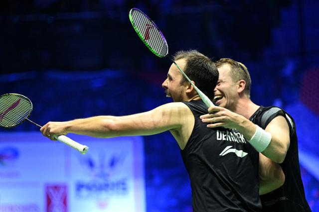 Denmark's Kim Astrup (R) and Denmark's Anders Rasmussen celebrate beating Japan's Yugo Kobayashi and Japan's Takuro Hoki during the men's double quarter-final match at the Badminton BWF World Championships at the Adidas Arena in Paris, on August 29, 2025. (Photo by Bertrand GUAY / AFP)