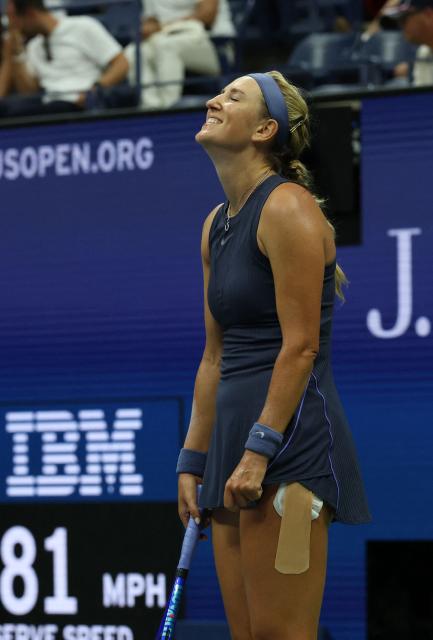 Belarus's Victoria Azarenka reacts as she plays USA's Jessica Pegula during their women's singles third round match on day six of the US Open tennis tournament at the USTA Billie Jean King National Tennis Center in New York City, on August 29, 2025. (Photo by TIMOTHY A.CLARY / AFP)