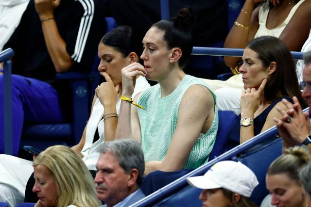 (L/R) Former basketball player Marta Xargay, WNBA player Breanna Stewart, and former soccer player Kelley O'Hara attend the women's singles final tennis match between Belarus's Aryna Sabalenka and USA's Amanda Anisimova on day fourteen of the US Open tennis tournament at the USTA Billie Jean King National Tennis Center in New York City, on September 6, 2025. (Photo by KENA BETANCUR / AFP)