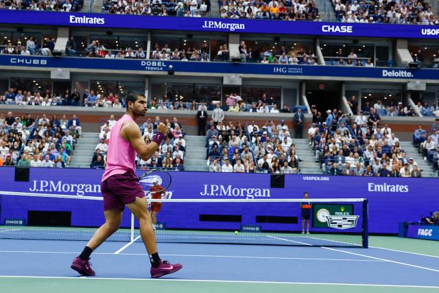 Spain's Carlos Alcaraz celebrates a point against Italy's Jannik Sinner during the men's singles final tennis match on day fifteen of the US Open tennis tournament at the USTA Billie Jean King National Tennis Center in New York City on September 7, 2025. (Photo by KENA BETANCUR / AFP)
