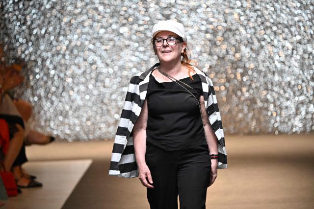 Hungarian fashion designer Katti Zoob reacts as she receives applause at the end of her fashion show on September 7, 2025, at the Millenaris cultural center in Budapest, Hungary during the Budapest Central European Fashion Week. (Photo by Attila KISBENEDEK / AFP)