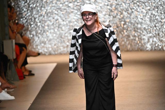 Hungarian fashion designer Katti Zoob reacts as she receives applause at the end of her fashion show on September 7, 2025, at the Millenaris cultural center in Budapest, Hungary during the Budapest Central European Fashion Week. (Photo by Attila KISBENEDEK / AFP)