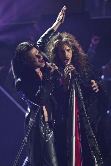 British singer-songwriter Yungblud (L) and US singer-songwriter Steven Tyler perform on stage during the MTV Video Music Awards at UBS Arena in Elmont, New York, on September 7, 2025. (Photo by ANGELA WEISS / AFP)