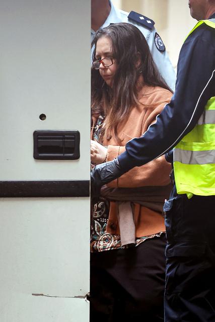 Convicted killer Erin Patterson leaves the Supreme Court of Victoria in Melbourne on September 8, 2025. An Australian judge sentenced Patterson on September 8 to life in prison with parole after 33 years for killing three people with toxic mushrooms, capping a trial that sparked a global media frenzy. (Photo by MARTIN KEEP / AFP)