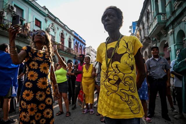 Followers of the Virgin of Charity, Oxun in the Yoruba religion, attend a procession during the Oxun Day celebrations in havana on September 8, 2025. (Photo by YAMIL LAGE / AFP)