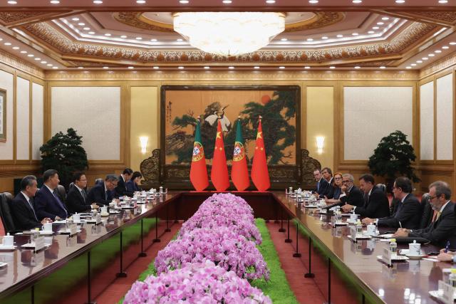 Chinese President Xi Jinping (2-L) and Portuguese Prime Minister Luis Montenegro (3-R) attend a meeting at The Great Hall of the People in Beijing on September 9, 2025. (Photo by Lintao Zhang / POOL / AFP)