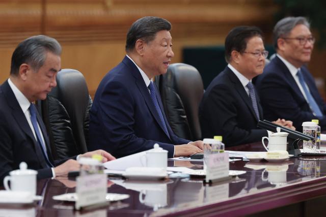 Chinese President Xi Jinping speaks at the beginning of a bilateral meeting with Portuguese Prime Minister Luis Montenegro (not pictured) at The Great Hall of the People in Beijing on September 9, 2025. (Photo by Lintao Zhang / POOL / AFP)