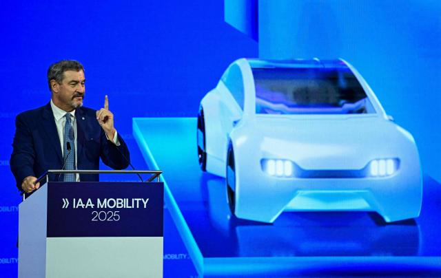 Bavaria's State Premier and leader of the conservative Christian Social Union (CSU) Markus Soeder speaks on stage during the opening of the International Motor Show IAA on September 9, 2025, in Munich, southern Germany. The IAA Mobility fair runs from September 9 to 14, 2025. (Photo by Tobias SCHWARZ / AFP)