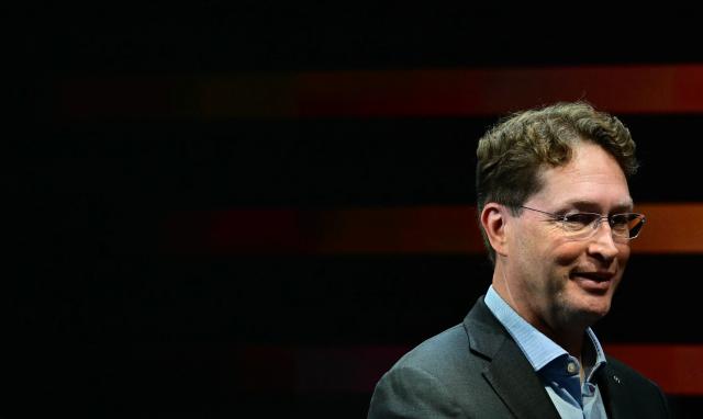 CEO of Mercedes-Benz AG Ola Kaellenius awaits the German Chancellor at the company's booth during the opening day of the International Motor Show IAA on September 9, 2025, in Munich, southern Germany. The IAA Mobility fair runs from September 9 to 14, 2025. (Photo by Tobias SCHWARZ / AFP)