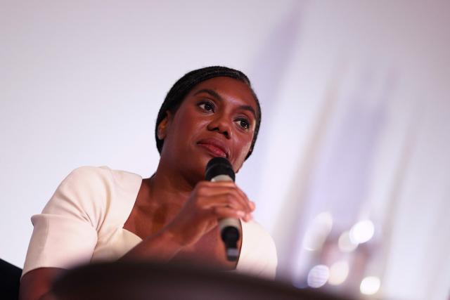 Britain's main opposition Conservative Party leader Kemi Badenoch speaks in conversation on stage in front of Union flags at the Institute of Chartered Accountants' Hall, in central London on September 9, 2025. (Photo by Adrian DENNIS / AFP)