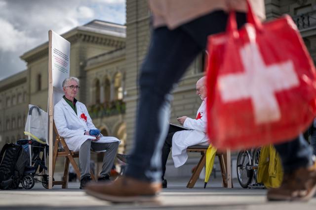 Members of Swiss Healthcare Workers Against Genocide Doctor Max Hilfiker (L) and professor Pietro Majno-Hurst stage a three-week hunger strike in front of the Federal Palace during Parliament’s autumn session, urging Switzerland to ensure respect for the Geneva Conventions in Gaza by protecting medical personnel and facilities and allowing humanitarian aid to enter, in Bern, on September 9, 2025. (Photo by Fabrice COFFRINI / AFP)