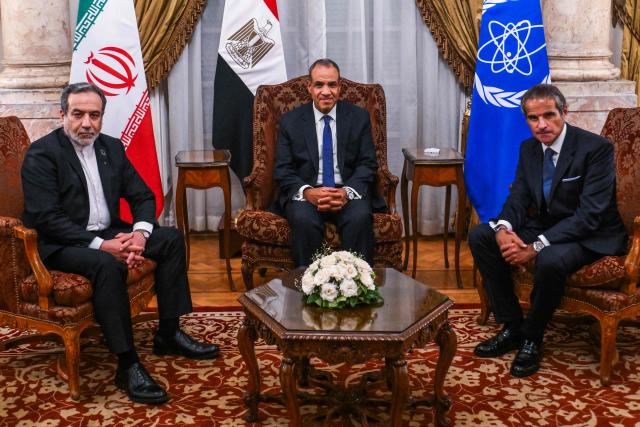 Egypt's Foreign Minister Badr Abdelatty (C) meets with his Iranian counterpart Abbas Araqchi (L) and Director General of the International Atomic Energy Agency (IAEA) Rafael Grossi in Cairo on September 9, 2025. This is the first meeting between Tehran and the IAEA since Iran suspended cooperation following a 12-day war in June during which Israel and the United States struck Iranian nuclear facilities, after which Tehran has said future cooperation with the agency will take "a new form". (Photo by Ahmed HASAN / AFP)