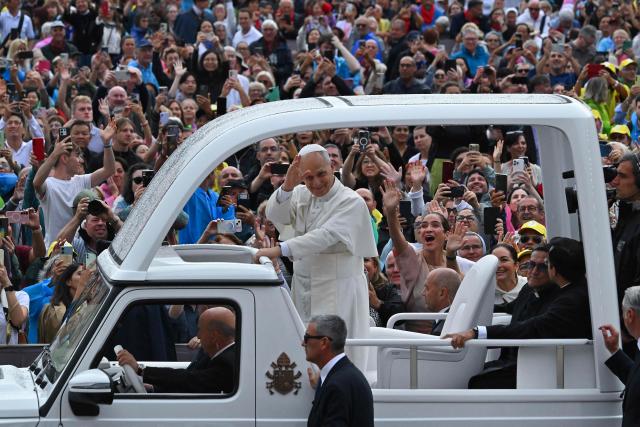 Pope Leo XIV waves to the crowd as he arrives in the Pope Mobile to lead the weekly general audience at St. Peter’s square in the Vatican on September 10, 2025. (Photo by Andreas SOLARO / AFP)